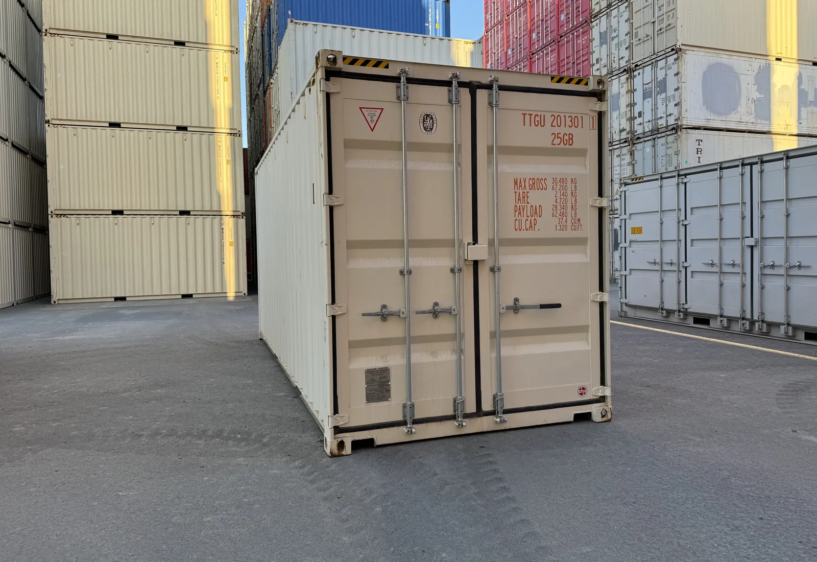 New single-trip 20ft shipping container in cream, front doors closed